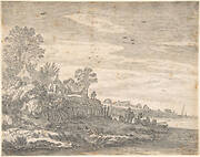 Village on an estuary, with a rowing boat on the shore