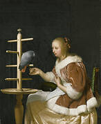 Young Woman Feeding a Parrot