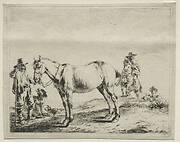 Man holding a horse by the bridle